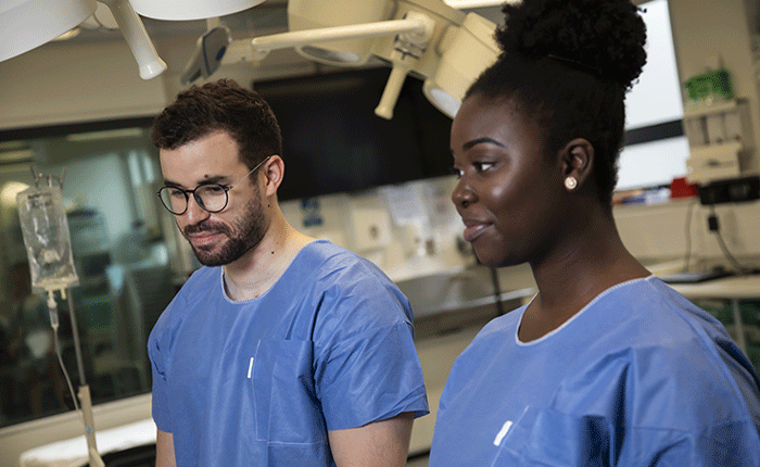 Two students in medical scrubs