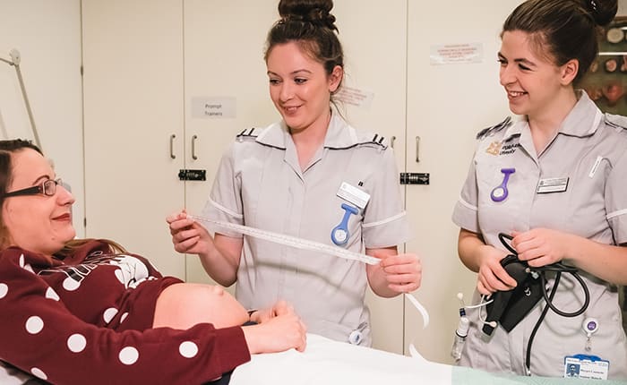 Midwifery students in skills lab