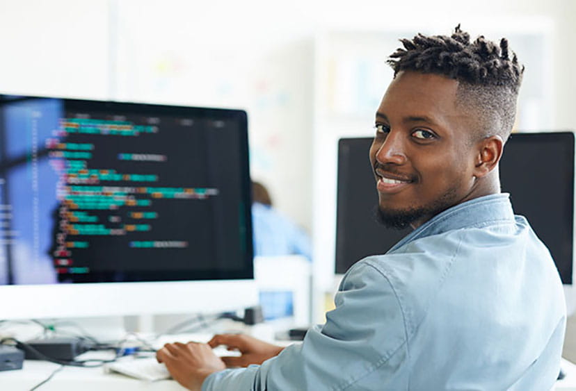 Man sitting at desk with computer