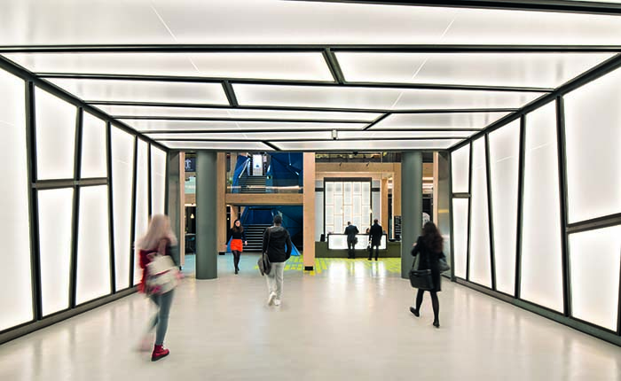 Students walking through the interior of an ARU London campus building