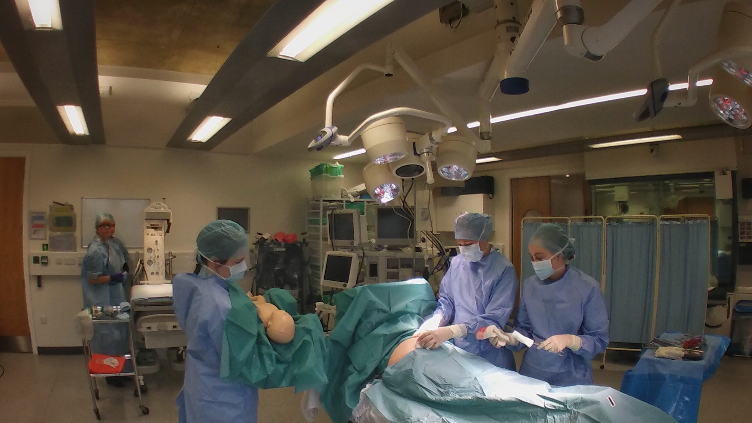 Students practising delivery in an Operating Theatre