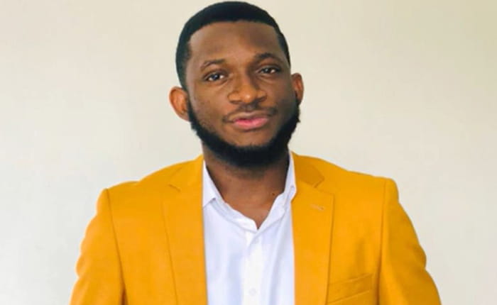 International student, Charles looking at camera