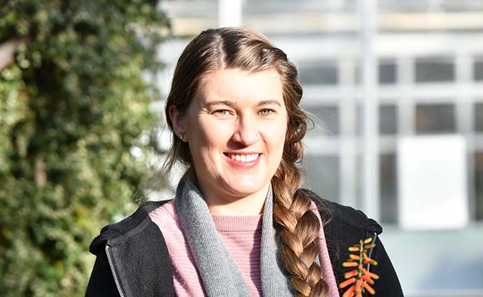 Student in a greenhouse at Writtle College