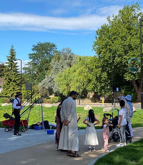 A magician performing for a family