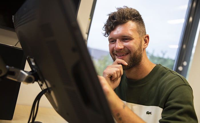 Computer games student working on a PC