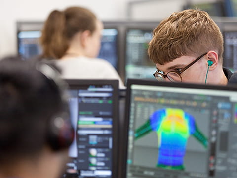 Students working in a computer suite on campus