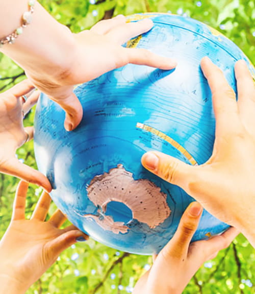 Hands on globe