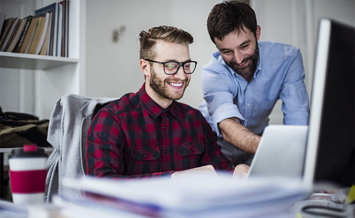 iStock image, men looking at a computer