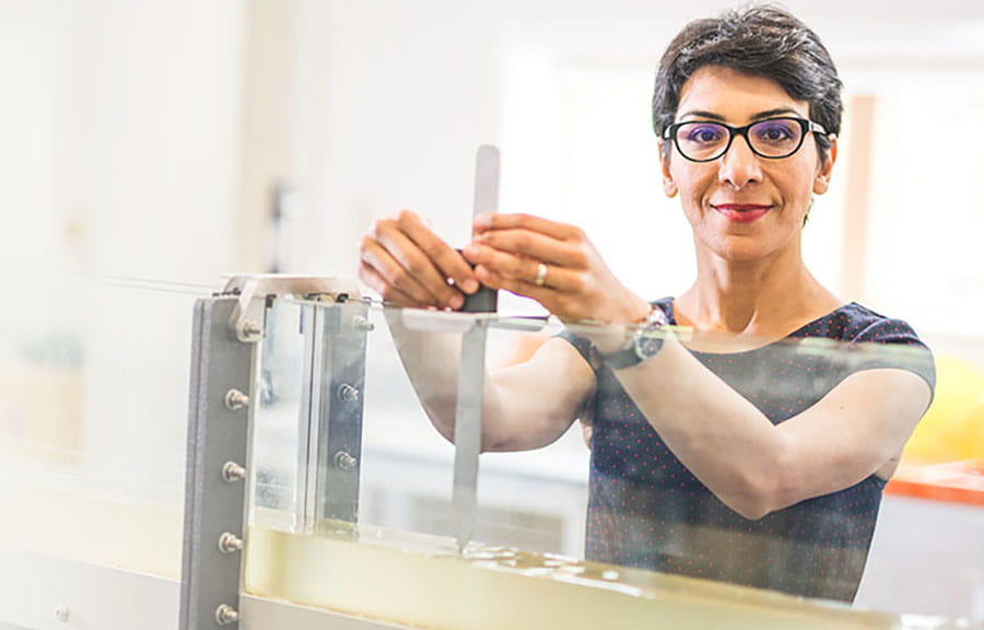 A member of ARU staff works in a lab
