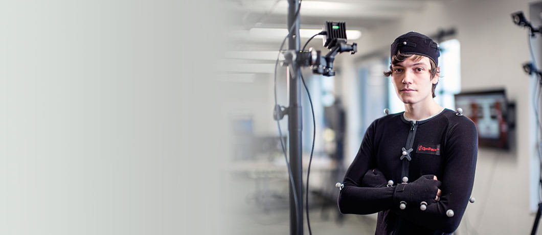 Computer gaming student in a studio wearing sensors