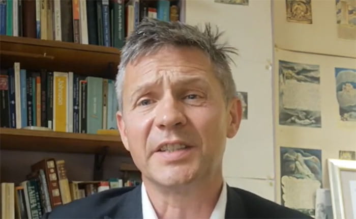 Prof John Gardner addressing the camera