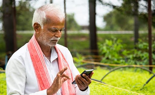 Farmer in India using a smartphone app
