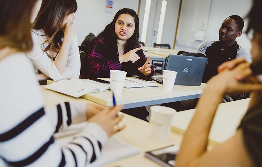 Five students in a university classroom