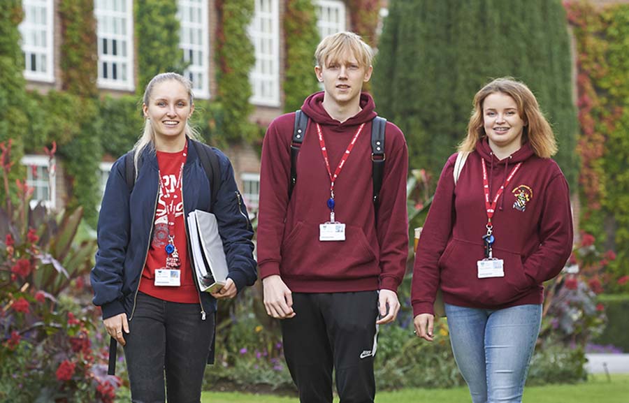 Three students walking outside Writtle College