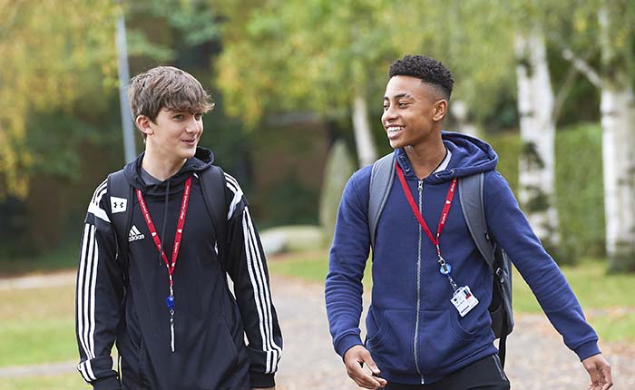 Two students walking in the grounds of Writtle College