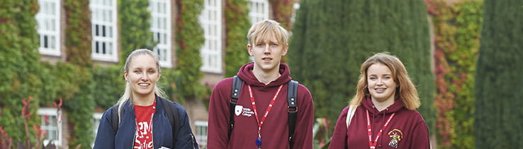 Three students outside the entrance building to Writtle College