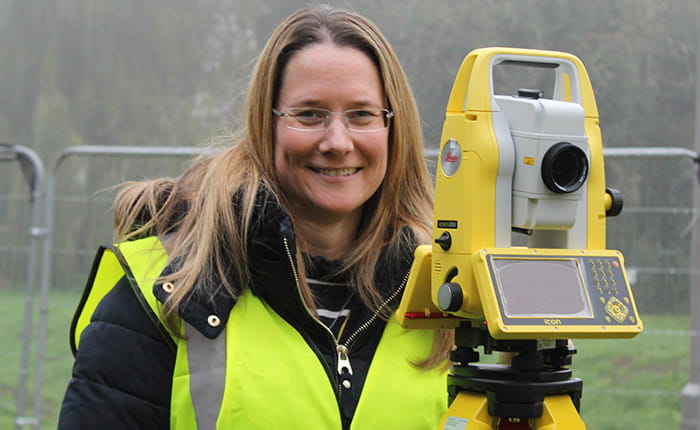 Construction Quantity Surveyor Degree Apprentice Gemma using surveying equipment