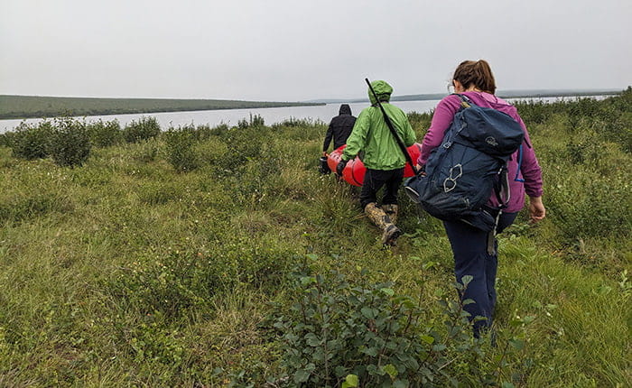 Max Kotokak Jr, George Harrison and Dr Helen Wheeler heading out to a study site in Inuvik
