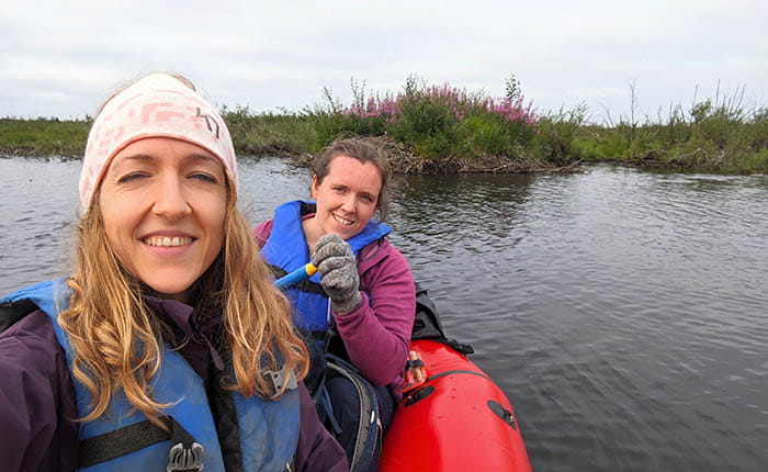 Georgia Hole and Helen Wheeler packrafting away from a successfully surveyed beaver lodge