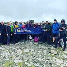 Harriet Line, Gym Supervisor with a walking group on the peak of a mountain