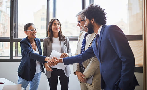 Four people meeting in an office
