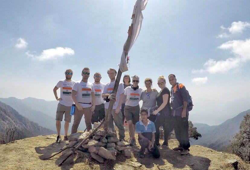 International Community Experience group at the top of a mountain