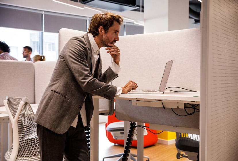 An office worker at a standing desk