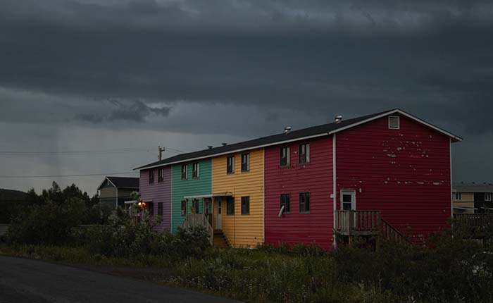 Houses in Inuvik, Northwest Territories, with storm clouds overhead