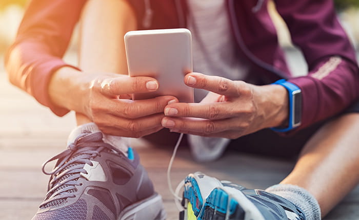 A jogger using a phone