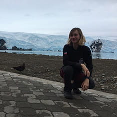 Kasia Komarowska with a bird in the Antarctic