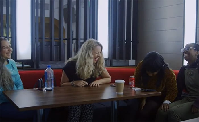 Law student Claudia laughing with three friends