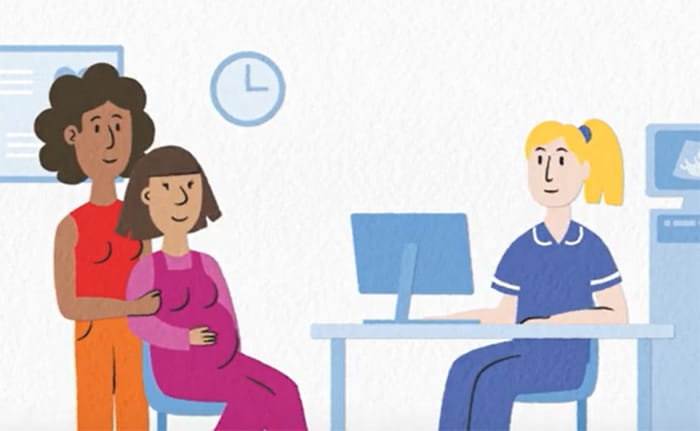 Animation still of a lesbian couple, one of whom is pregnant, in a healthcare setting with a midwife