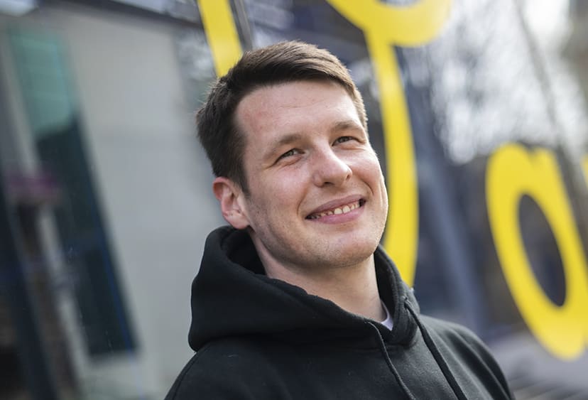 ARU student Liam outside on ARU's Cambridge campus