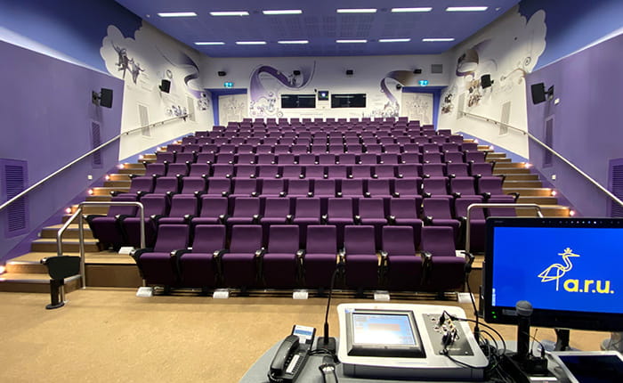 Lecture theatre with presenter's lectern in foreground