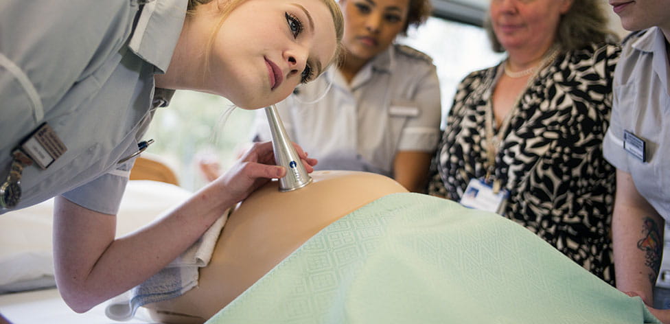 student using pinnard on mannequin