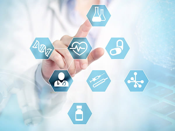 A hand reaching for medical icons on a screen