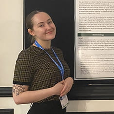 Nicola Beckett standing in front of a poster presentation