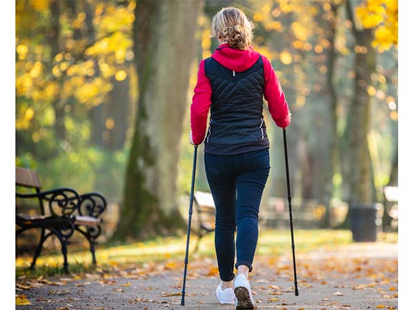 Woman using Nordic walking poles