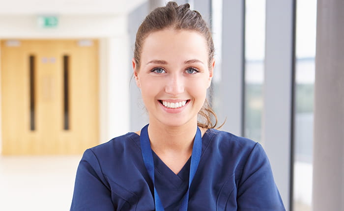 A smiling woman nursing associate