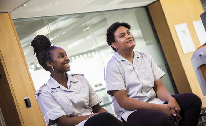 Two Nursing students sitting in an office
