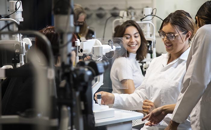 Optometry students working together in the teaching lab