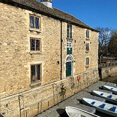 Rowboats docked by a building in Peterborough