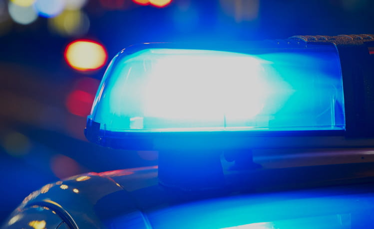 Close-up of the blue light on top of a police car