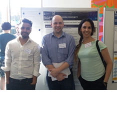Four alumni from ARU's Platelet Research Group sitting around a table