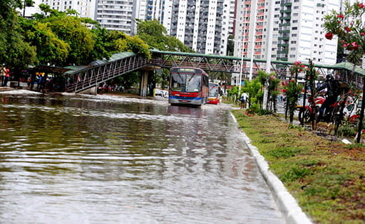 Bus driving along a flooded city street
