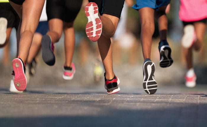 Back view of a group of legs running