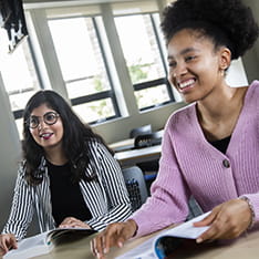Two social work students in class