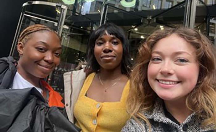 Three degree apprenticeship students outside a tech company building
