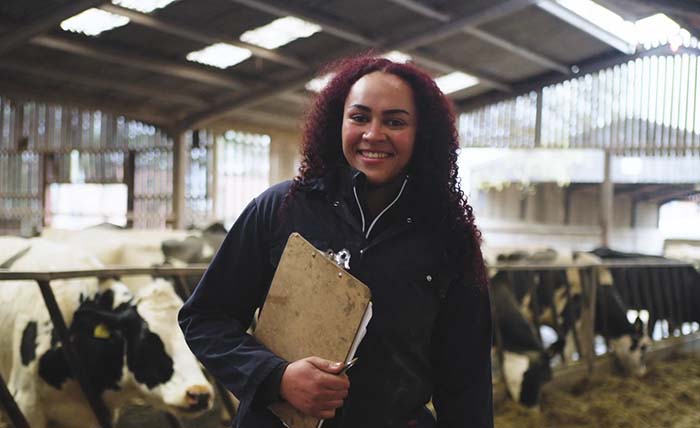 Land-based sector student in a cow shed