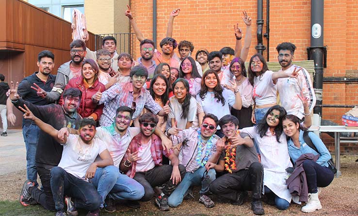 Group of students from an ARU student society celebrating Holi - the Hindu festival of colours